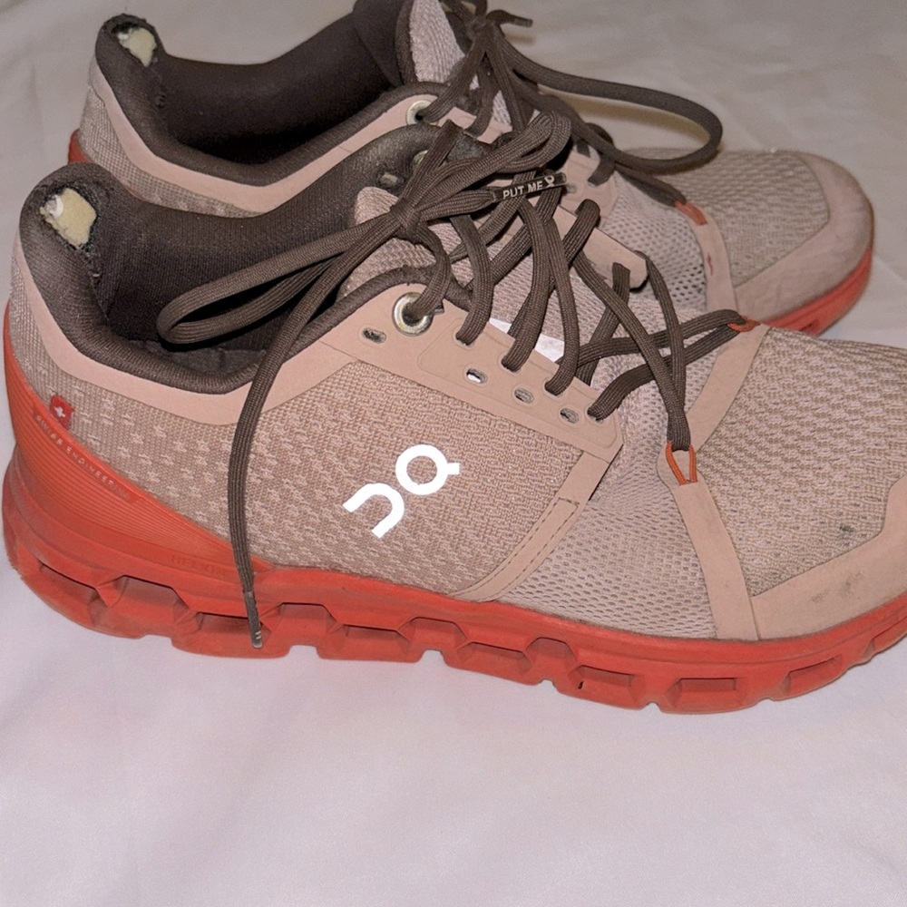 On Cloud Gray and Red Athletic Shoe